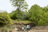 The dig site is located along a creek on a family farm near Oskaloosa, Iowa.